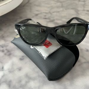 Ray Ban sunglasses.  Slightly scratched